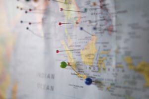 A picture of a global map with pins on certain countries, Amare Global is looking to expand its efforts worldwide.